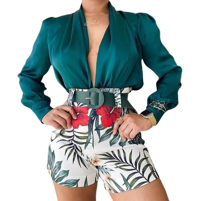 Women's fashion casual V-neck long-sleeved teal blouse paired with high-waisted floral printed shorts and a wide belt