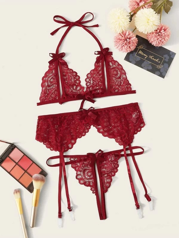 Red lace butterfly bra panty garter belt bikini three-piece lingerie set with floral design.