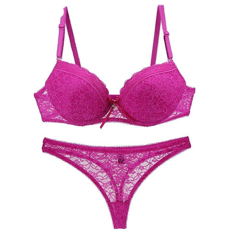 Sexy lace bra and thong underwear set in vibrant pink with intricate floral patterns and adjustable straps