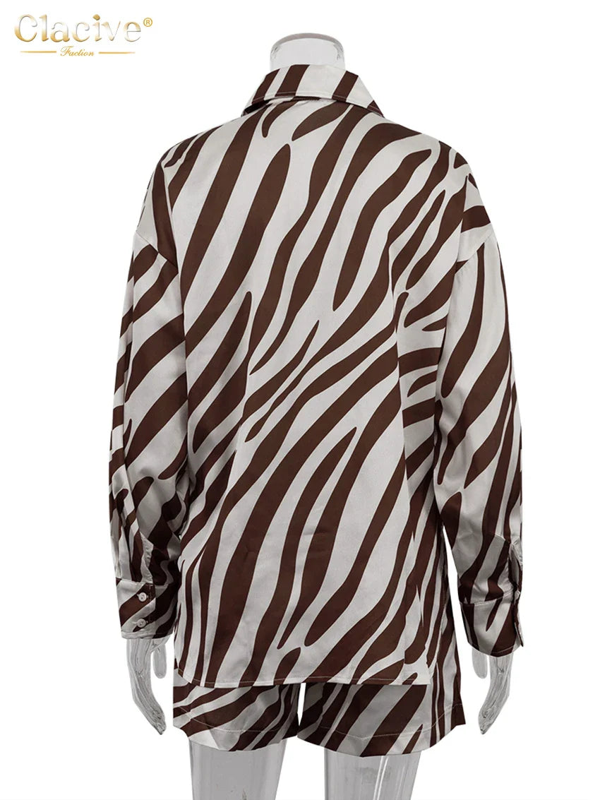 Back view of elegant stripe print long sleeve shirt with matching shorts women's outfit