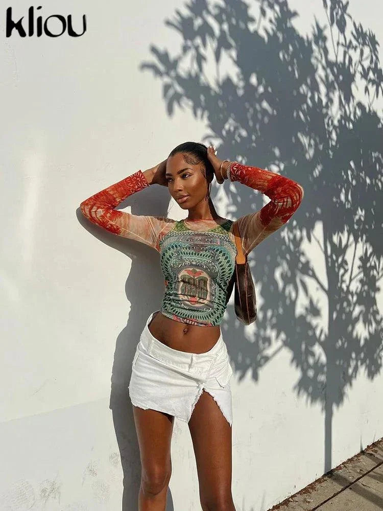 Kliou Dollar Print long sleeve mesh t-shirt worn by woman with white skirt outdoors