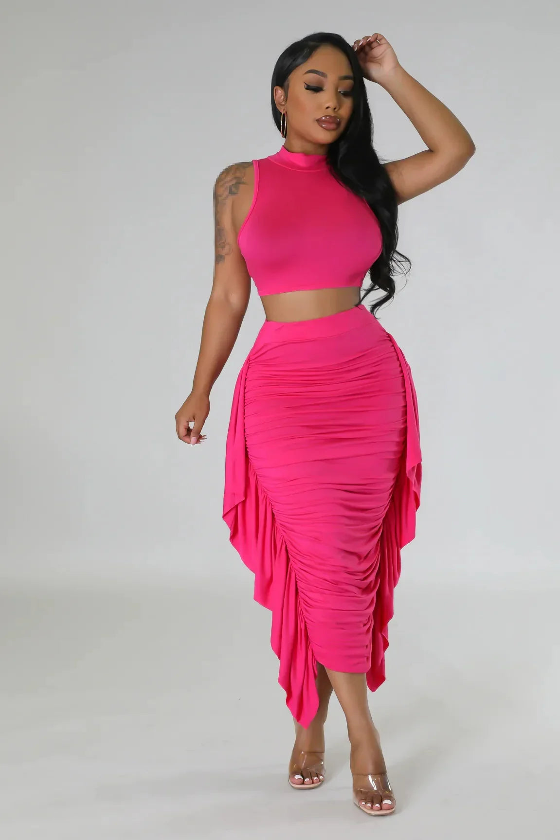 Woman modeling a hot pink ruched two-piece summer set from the Women’s Summer collection
