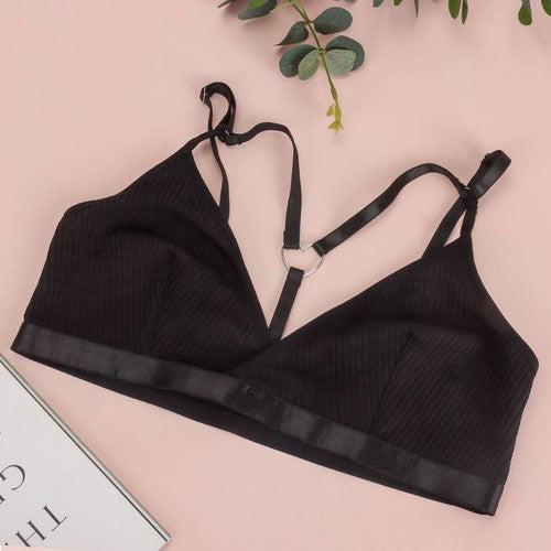 Black women's sexy lace bralette bustier crop top with adjustable straps and sheer detailing.