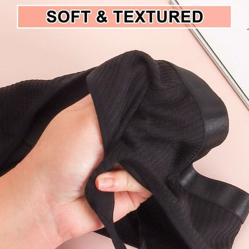 Black women's sexy lace bralette with soft and textured fabric detail held in hand