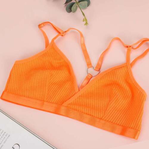 Orange women's sexy lace bralette with adjustable straps on pink background
