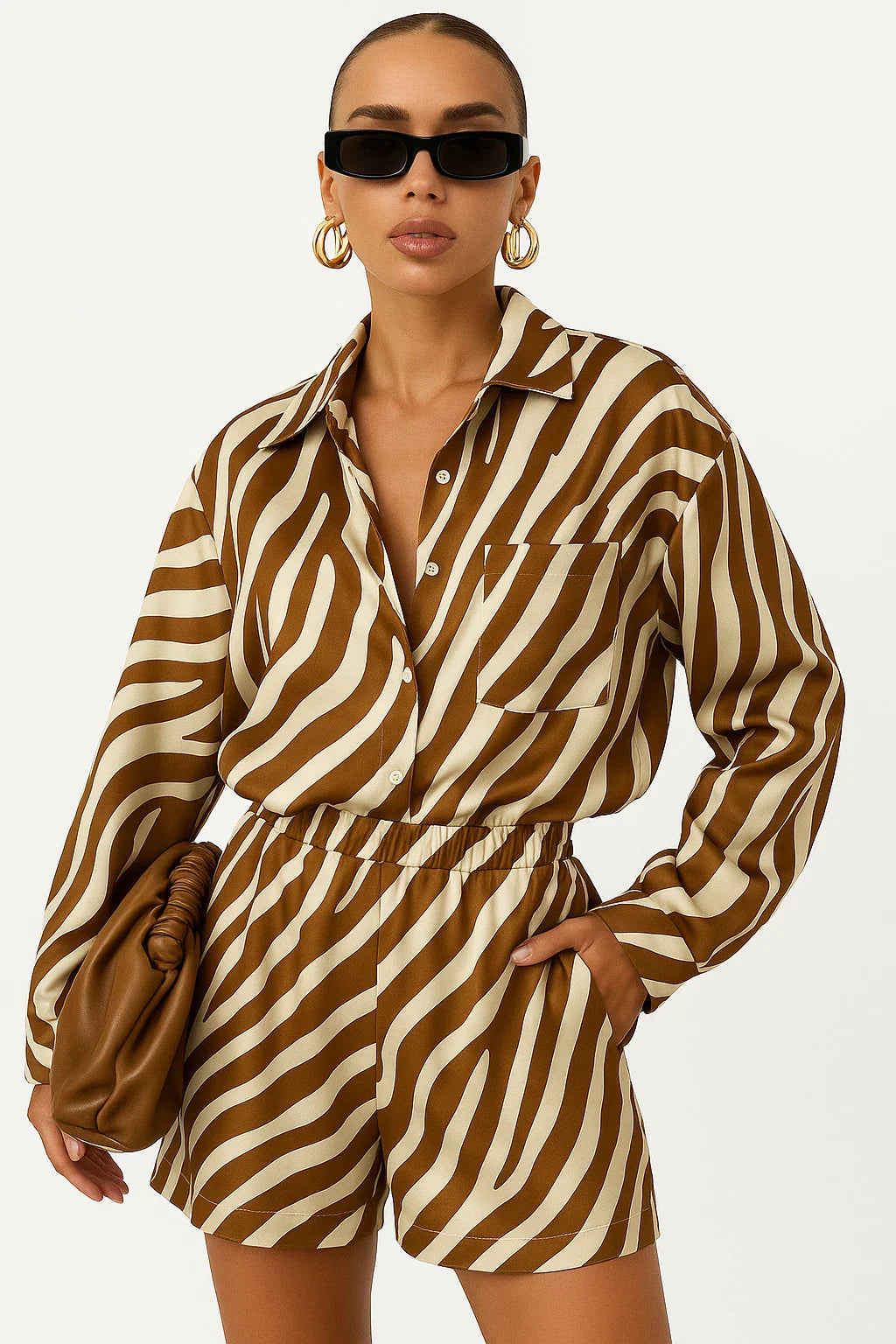 Woman wearing elegant stripe print brown and beige 2-piece outfit with long sleeve shirt and high-waisted shorts