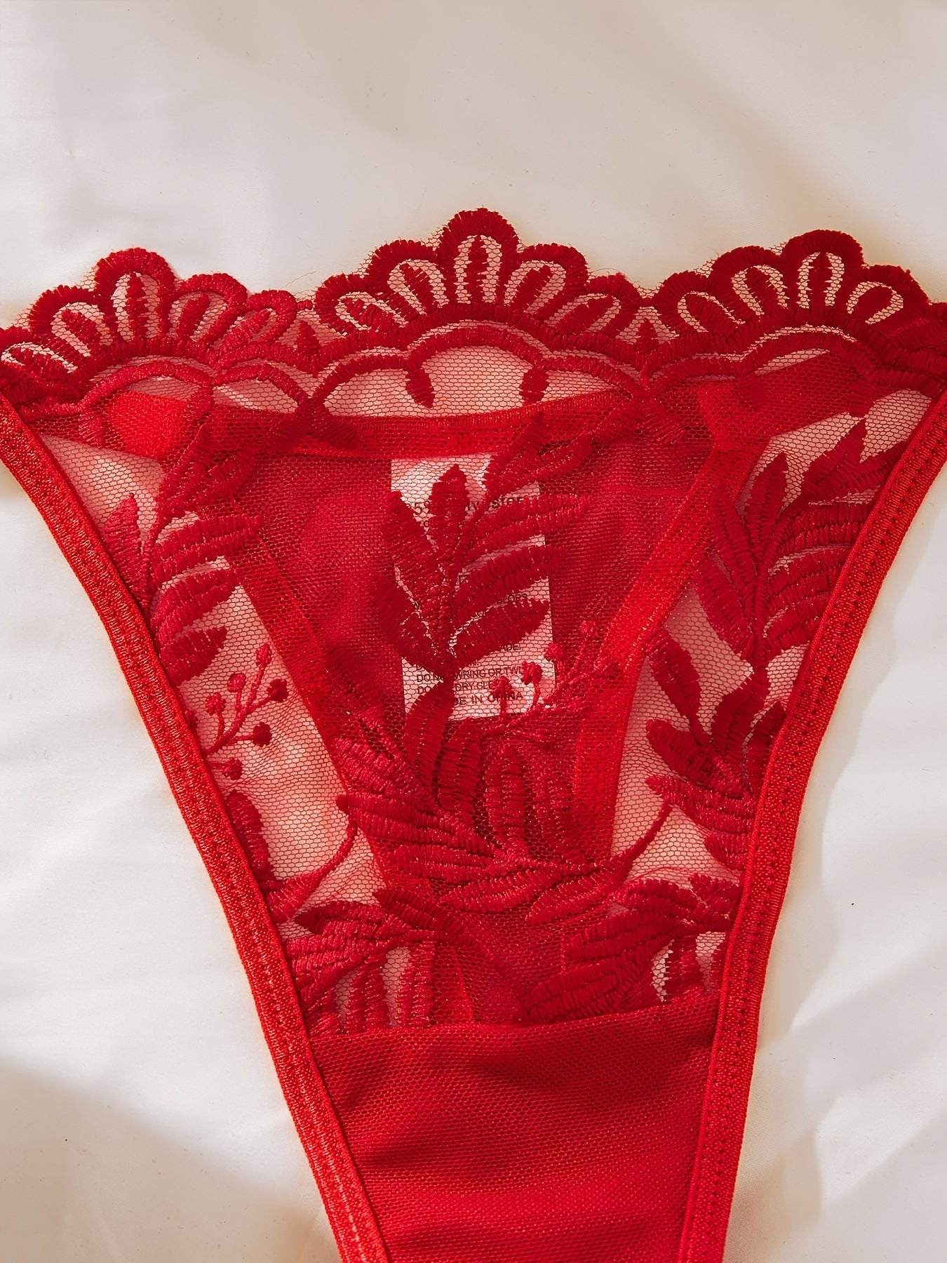 Red embroidered mesh lace women's lingerie thong with floral design