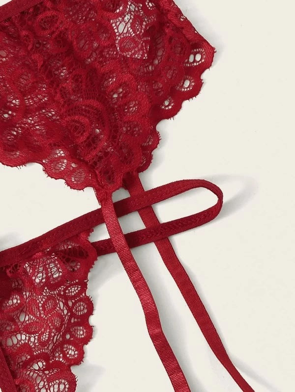 Red lace butterfly bra with delicate straps and intricate floral design