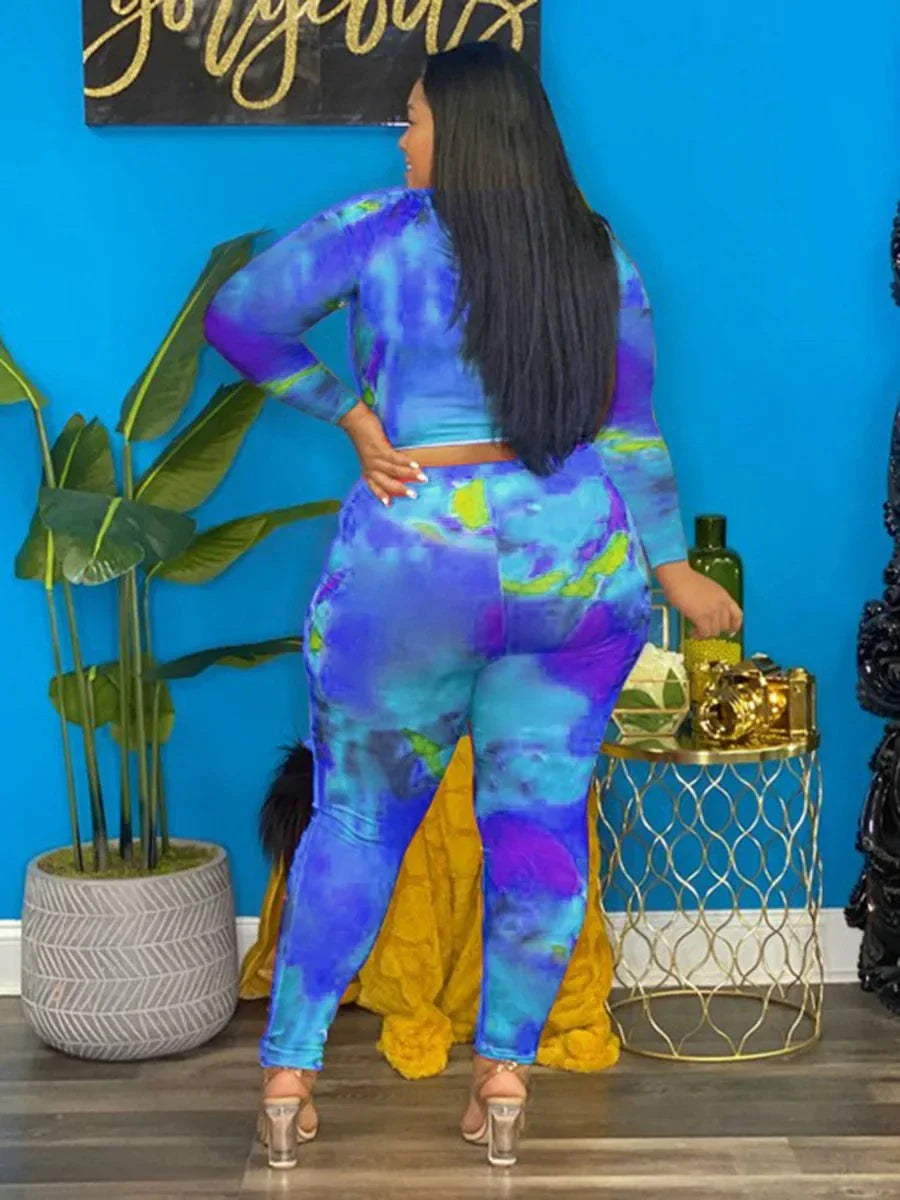 plus size tie dye long sleeve top and leggings set in blue and purple tones worn by model
