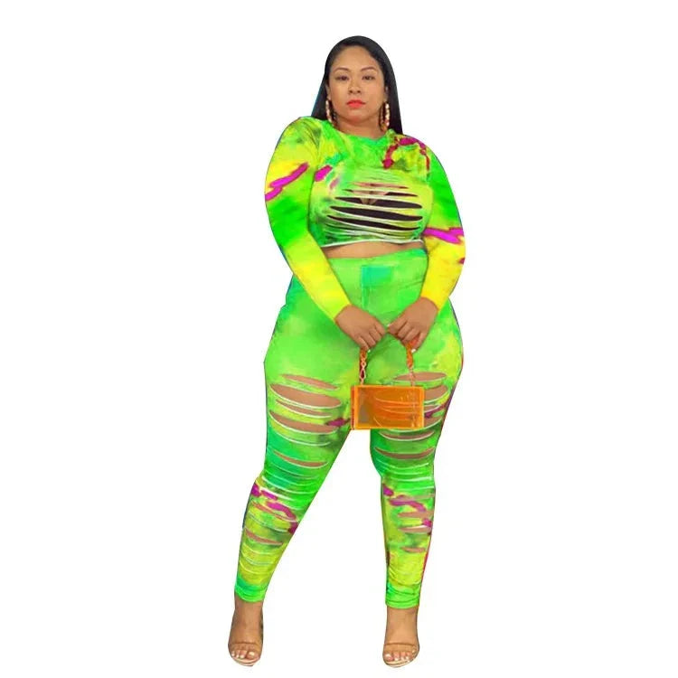 Plus size tie dye two-piece outfit with neon green and pink patterns and cutout details