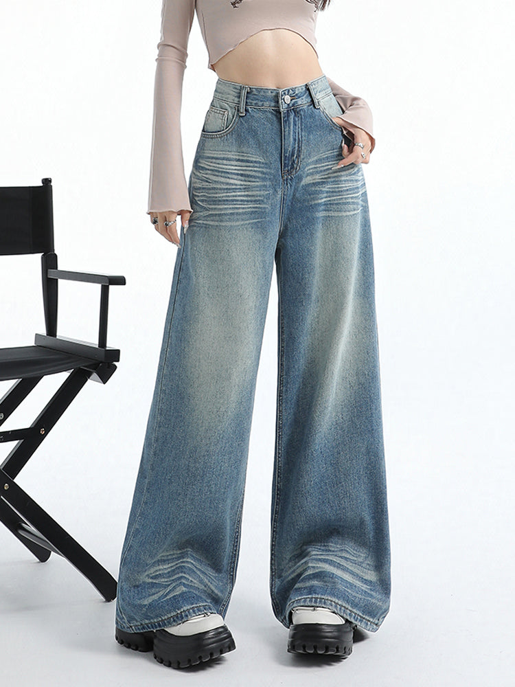 Vintage washed blue wide-leg straight jeans for women with relaxed fit and stylish faded detailing.
