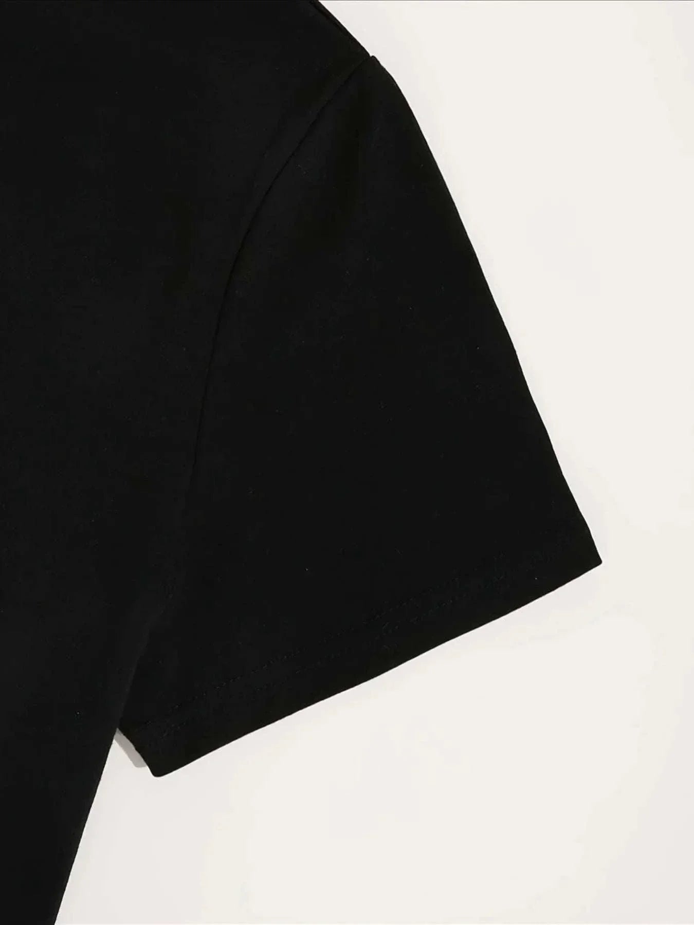 close-up of black short sleeve on plus size skull print summer dress