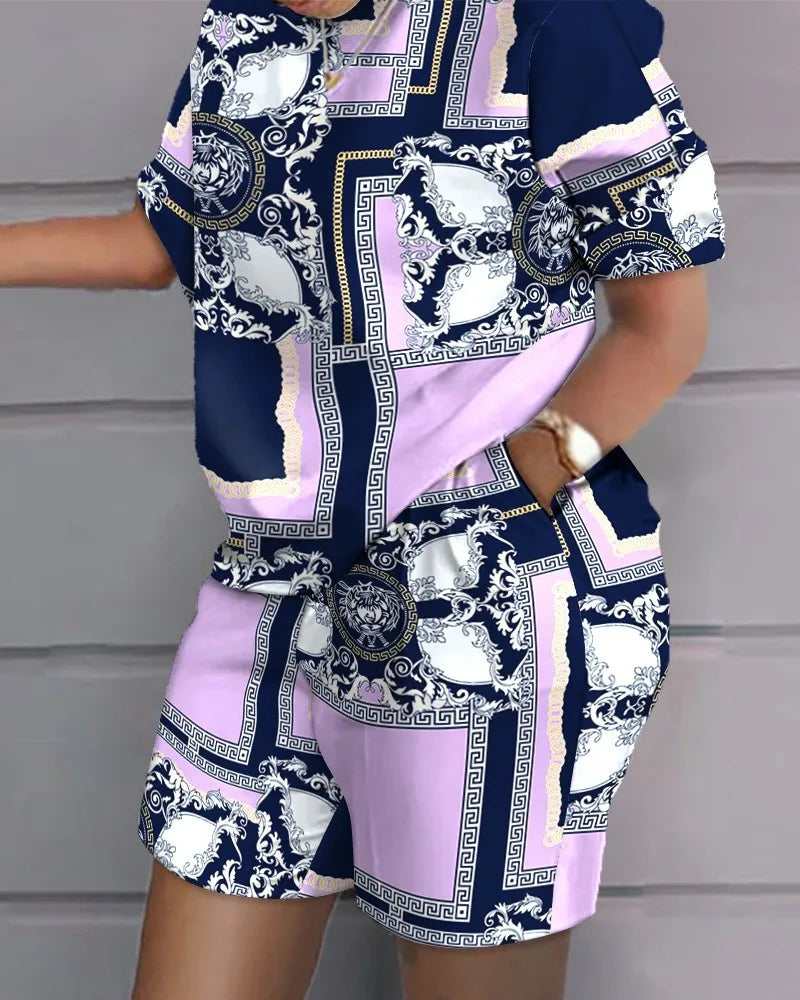 Woman wearing a stylish summer casual 2-piece outfit with letter printed top and matching shorts with pockets in navy, white, and lavender colors