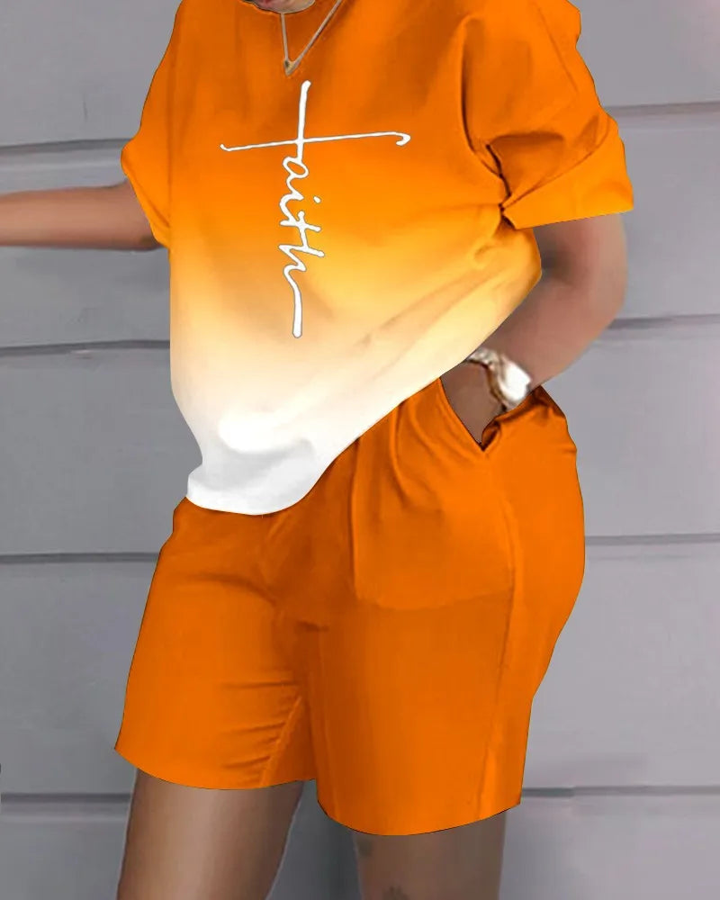 Woman wearing an orange and white gradient summer casual 2-piece outfit with a letter printed top and matching shorts with pockets.