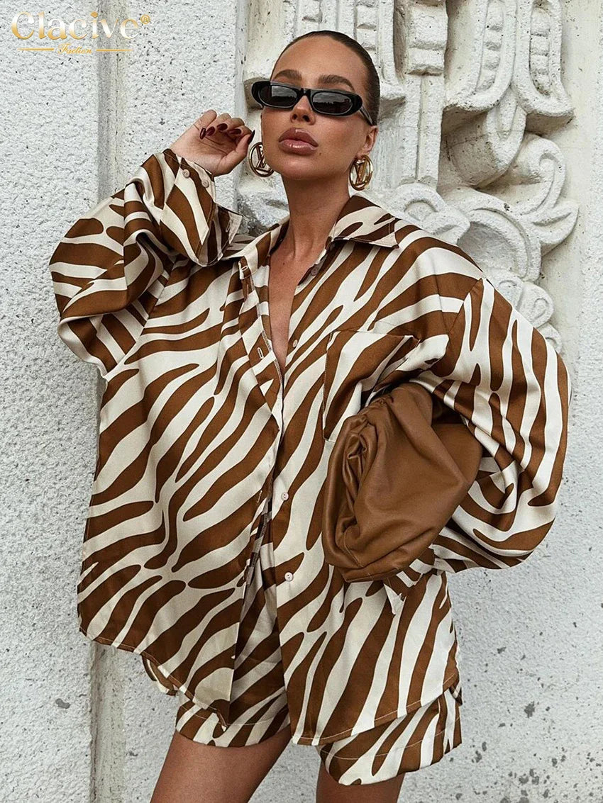Elegant stripe print 2-piece women's outfit with long sleeve shirt and high-waisted shorts in brown and cream colors.