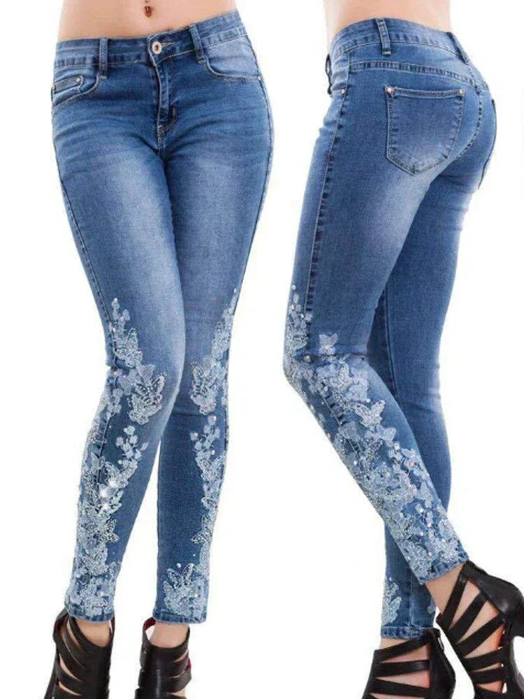 Blue floral embroidered skinny jeans for women with high waist and fitted silhouette