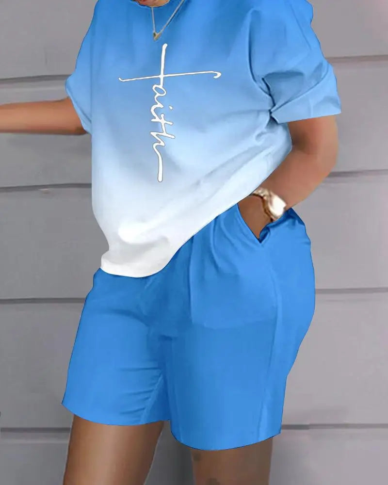 Woman wearing a blue and white gradient Summer Casual 2-Piece Outfit with a letter printed short sleeve top and blue shorts with pockets.