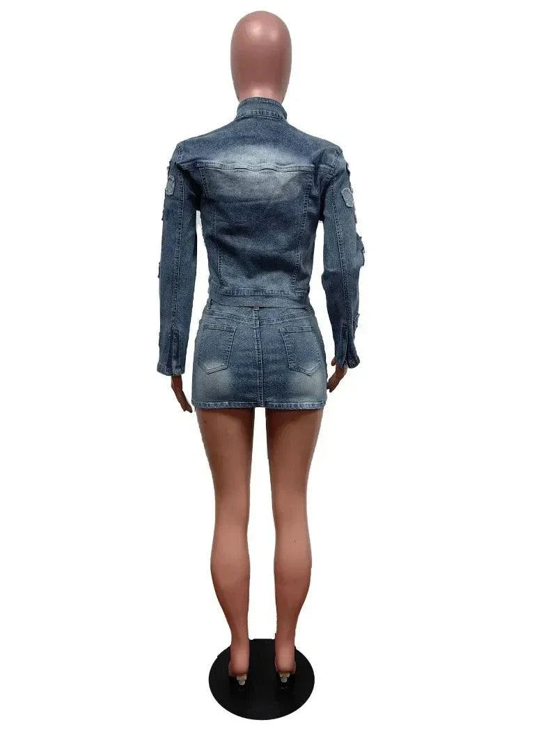 Back view of chic denim tassel two-piece set with fitted jacket and mini skirt on mannequin