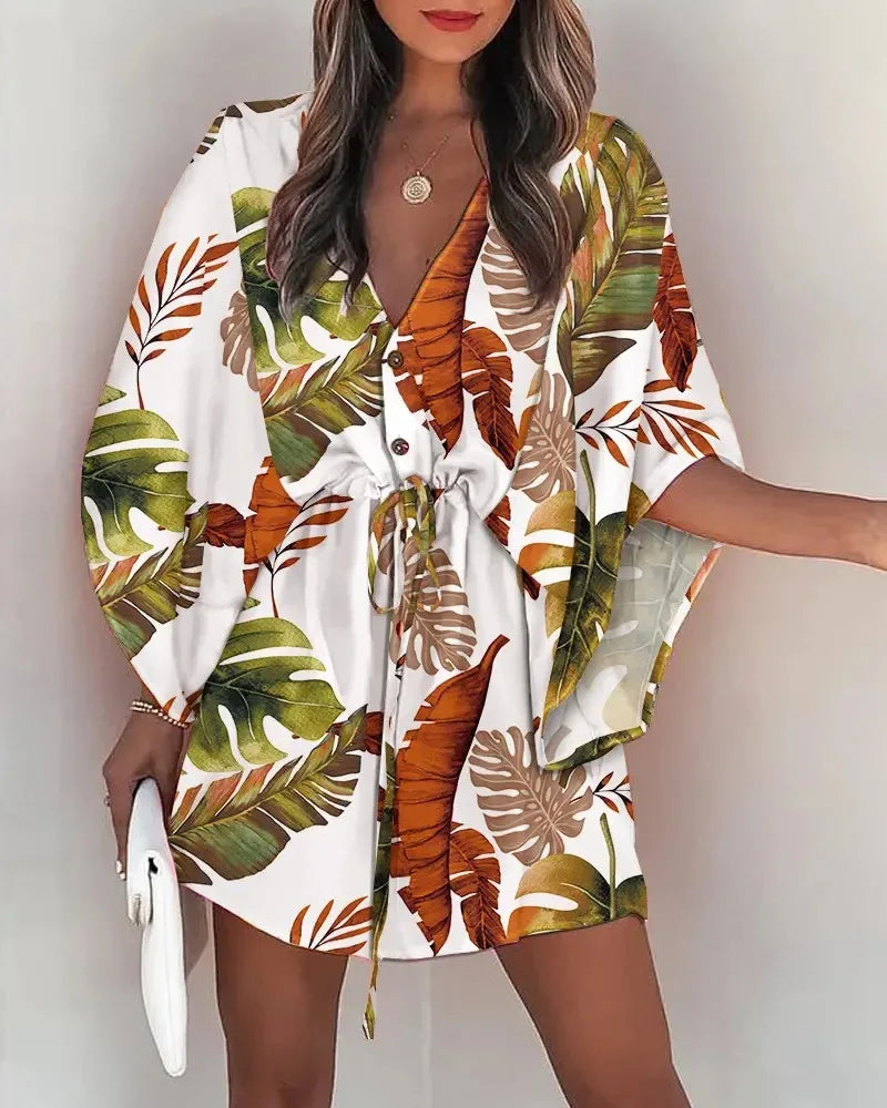Fashion print V-neck summer dress with lace-up front and tropical leaf pattern