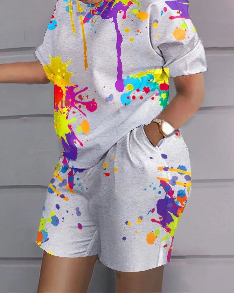 Summer Casual 2-Piece Outfit with colorful paint splatter design on grey fabric, featuring short sleeves and shorts with pockets for women