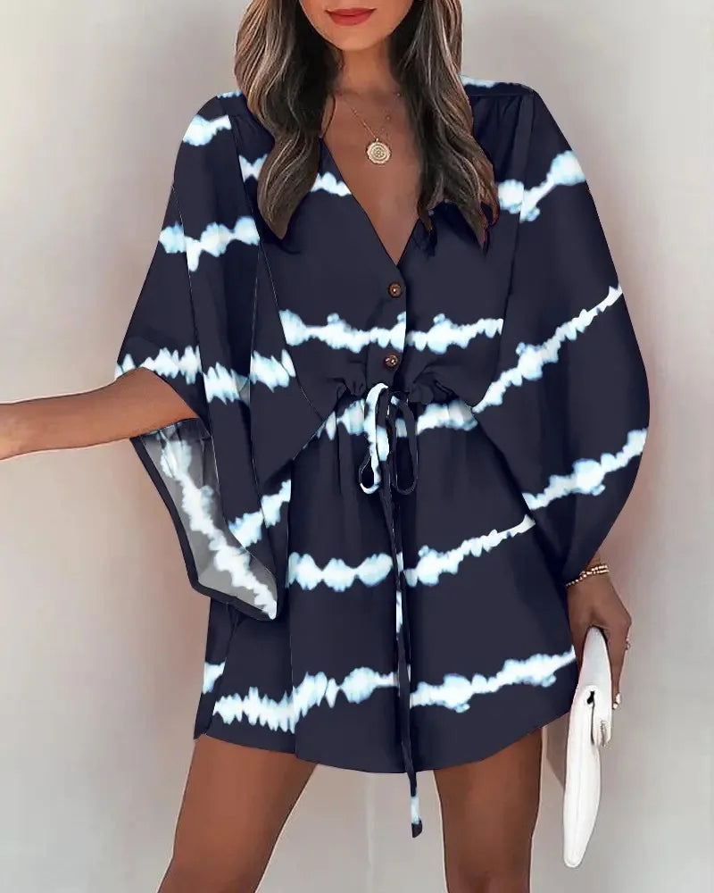 Fashion print V-neck lace-up summer dress with bold tie-dye pattern and relaxed fit.