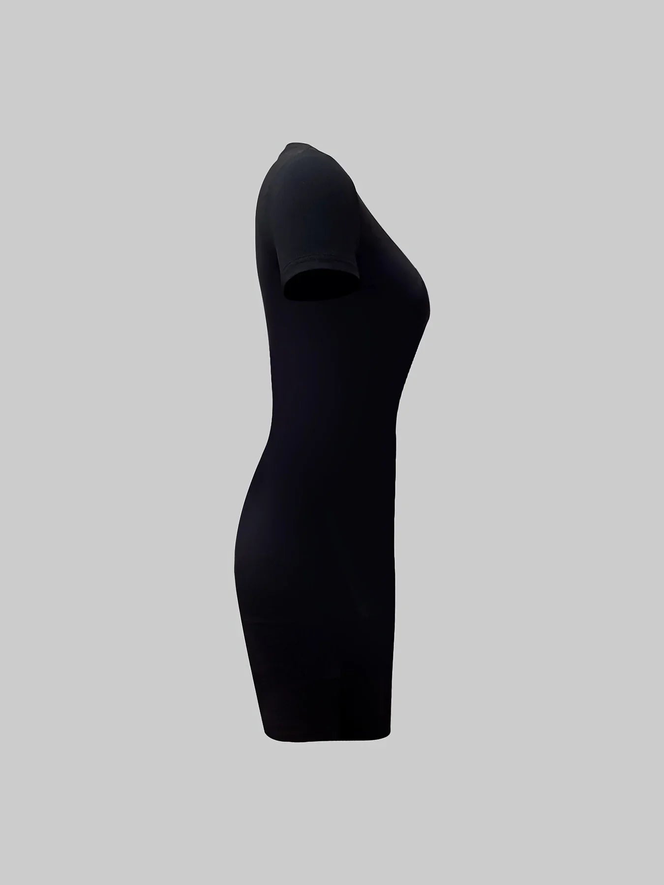 Plus size black slim fit T-shirt dress with short sleeves and round neckline, side view