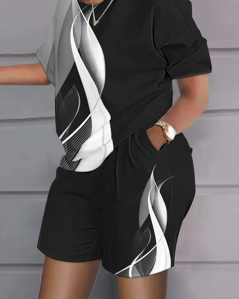 Women’s summer casual 2-piece outfit with black and white abstract design, short sleeves top, and matching shorts with pockets.