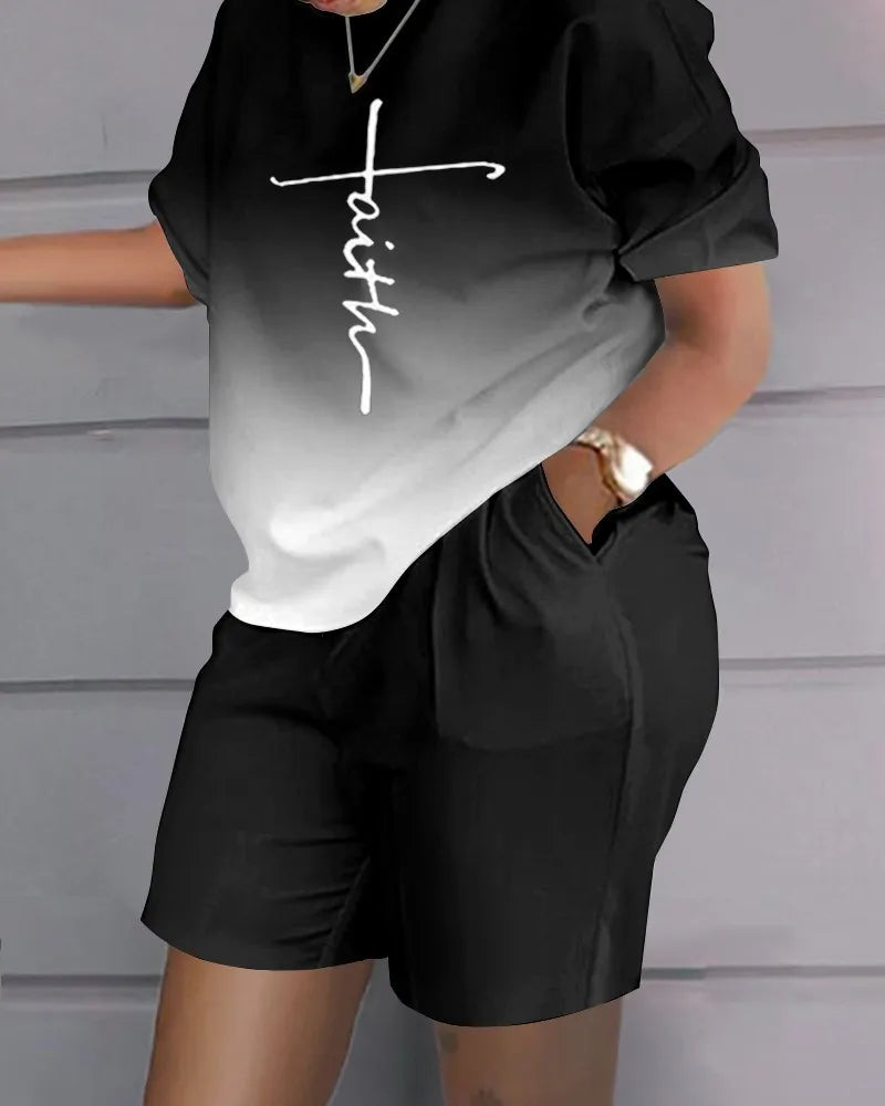 Woman wearing a black and white ombre Summer Casual 2-Piece Outfit with a letter print top and black shorts with pockets.