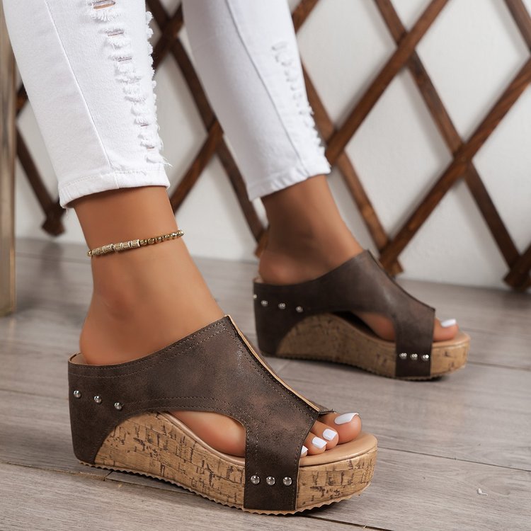 Plus size women's wedge peep toe platform sandals in dark brown with studded detailing and cork wedge sole.