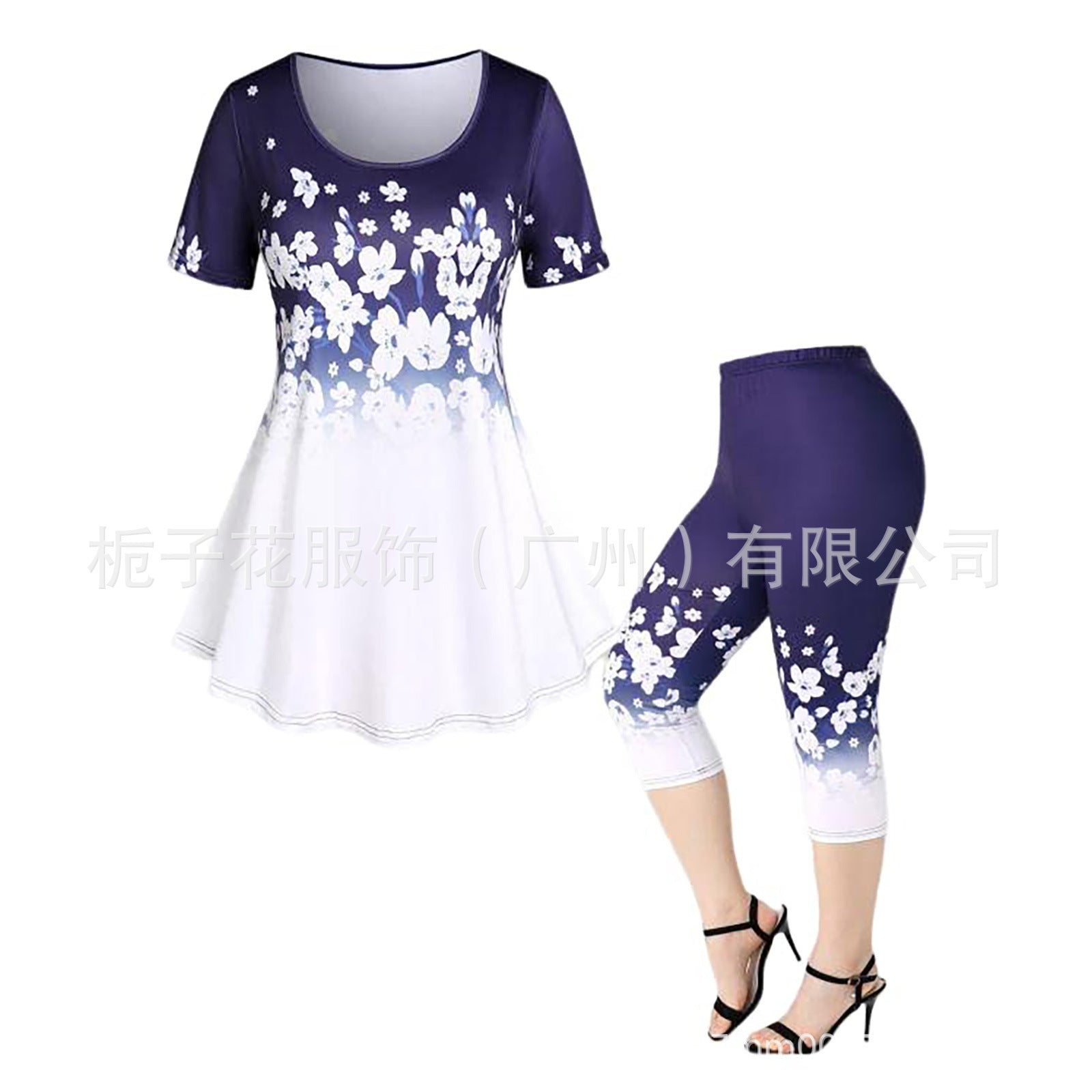 Women's two-piece summer casual set with floral print, short sleeves, and cropped pants in navy and white gradient design